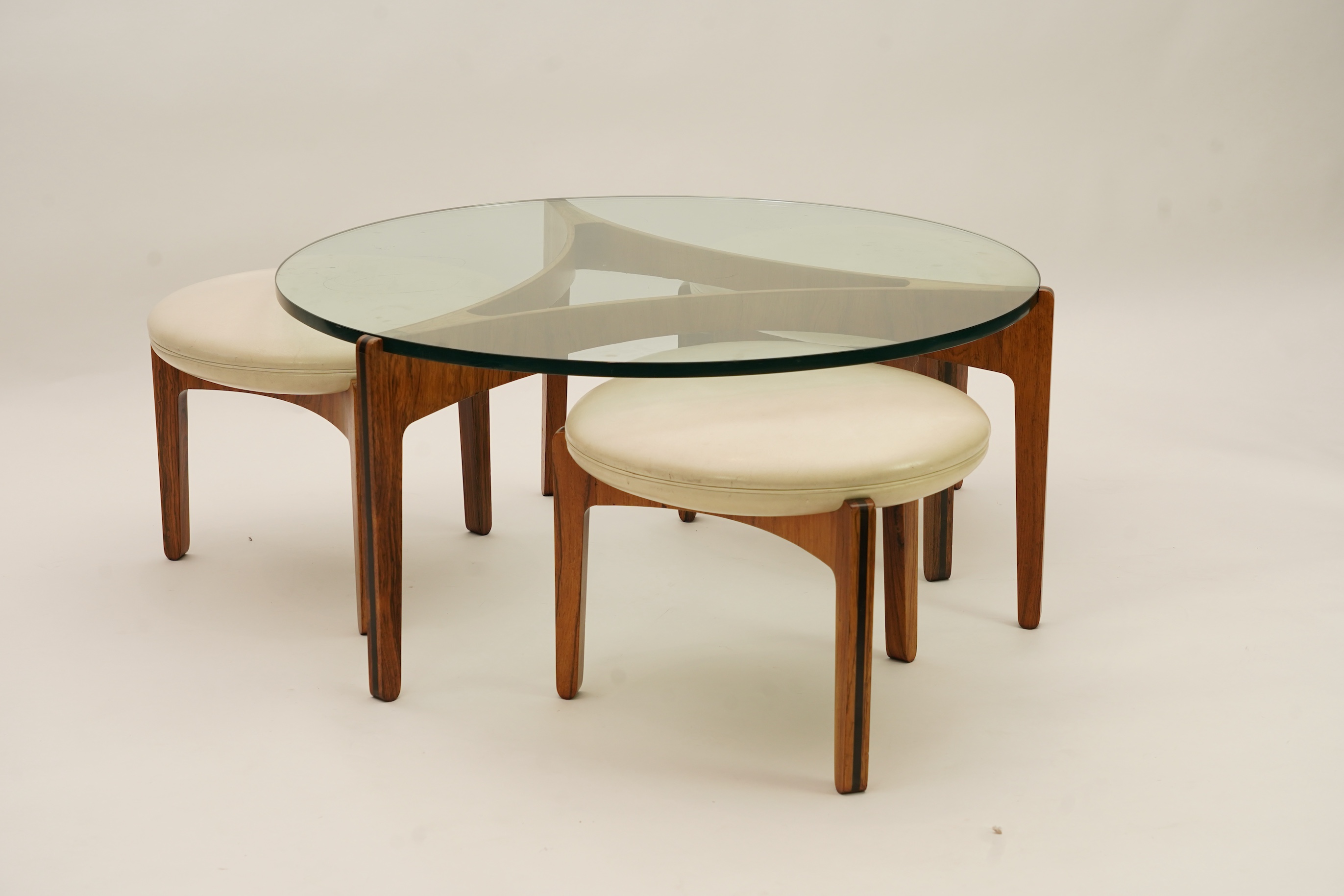 Sven Ellekaer (Danish, 1926-1984) for Christian Linneberg Møbelfabrik: A coffee table and three nesting stools ensuite